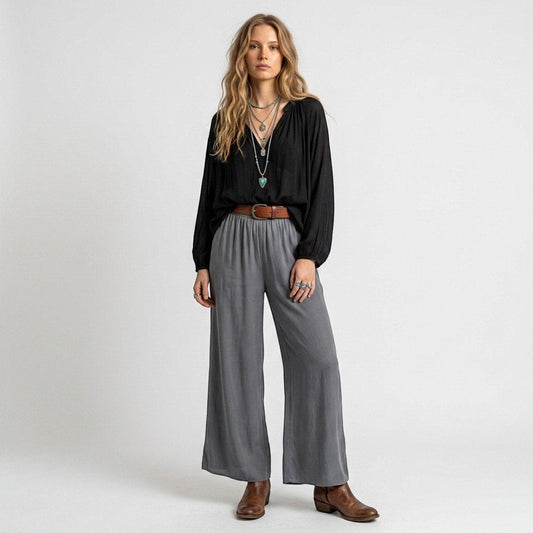 Model wearing Lynn's Closet Boutique gray silk-blend wide-leg pants with an elastic waistband and brown leather belt.
