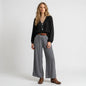 Model wearing Lynn's Closet Boutique gray silk-blend wide-leg pants with an elastic waistband and brown leather belt.