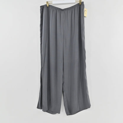 Lynn's Closet Boutique Nouvelle gray wide-leg silk-blend pants with an elastic waistband hanging on a hanger.