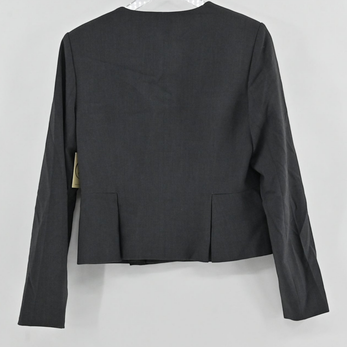 Lynn's Closet Boutique Calvin Klein charcoal gray collarless suit jacket, back view showing tailored pleat detail.
