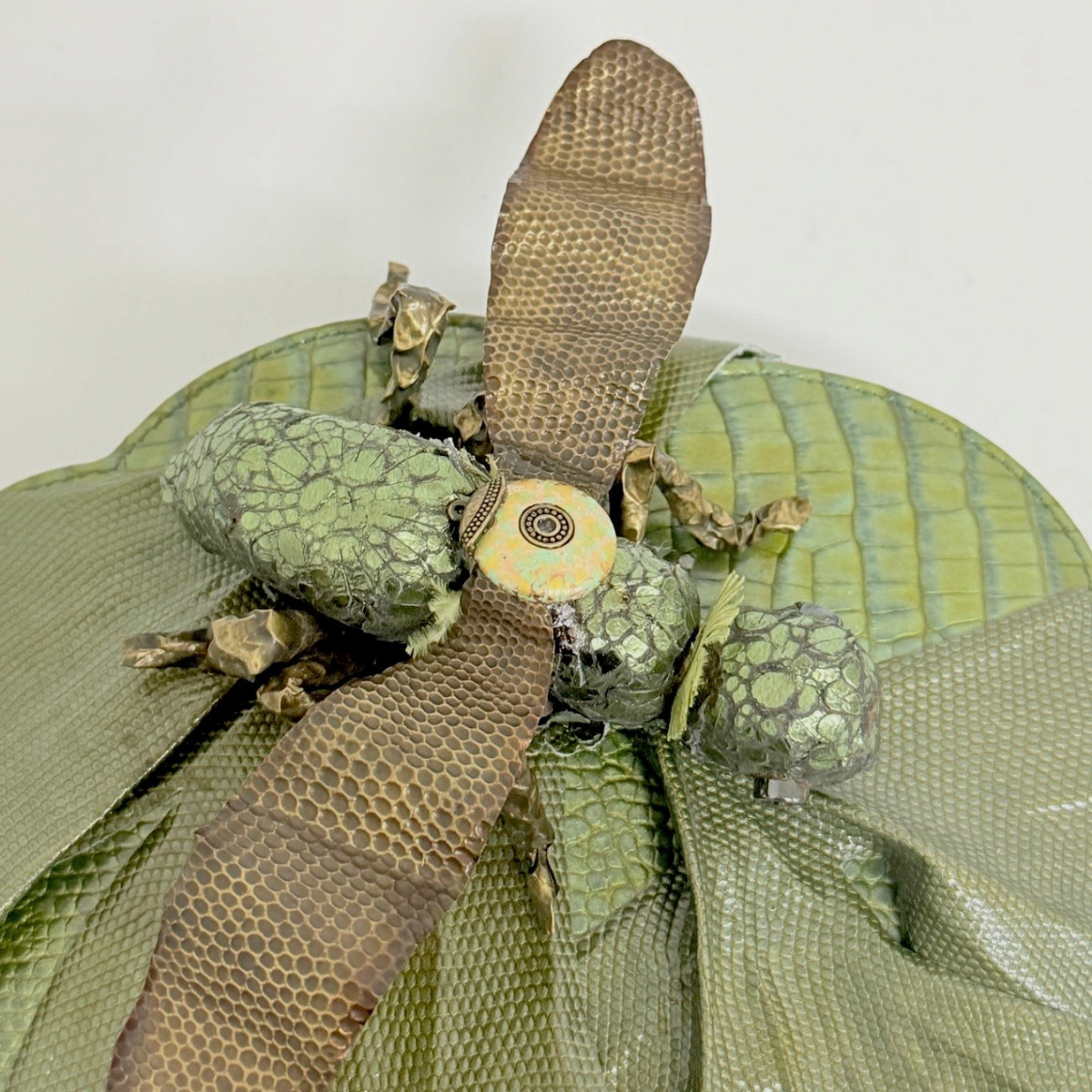 Lynn's Closet Boutique green leather grasshopper bag featuring sculptural insect motif and textured wing details.