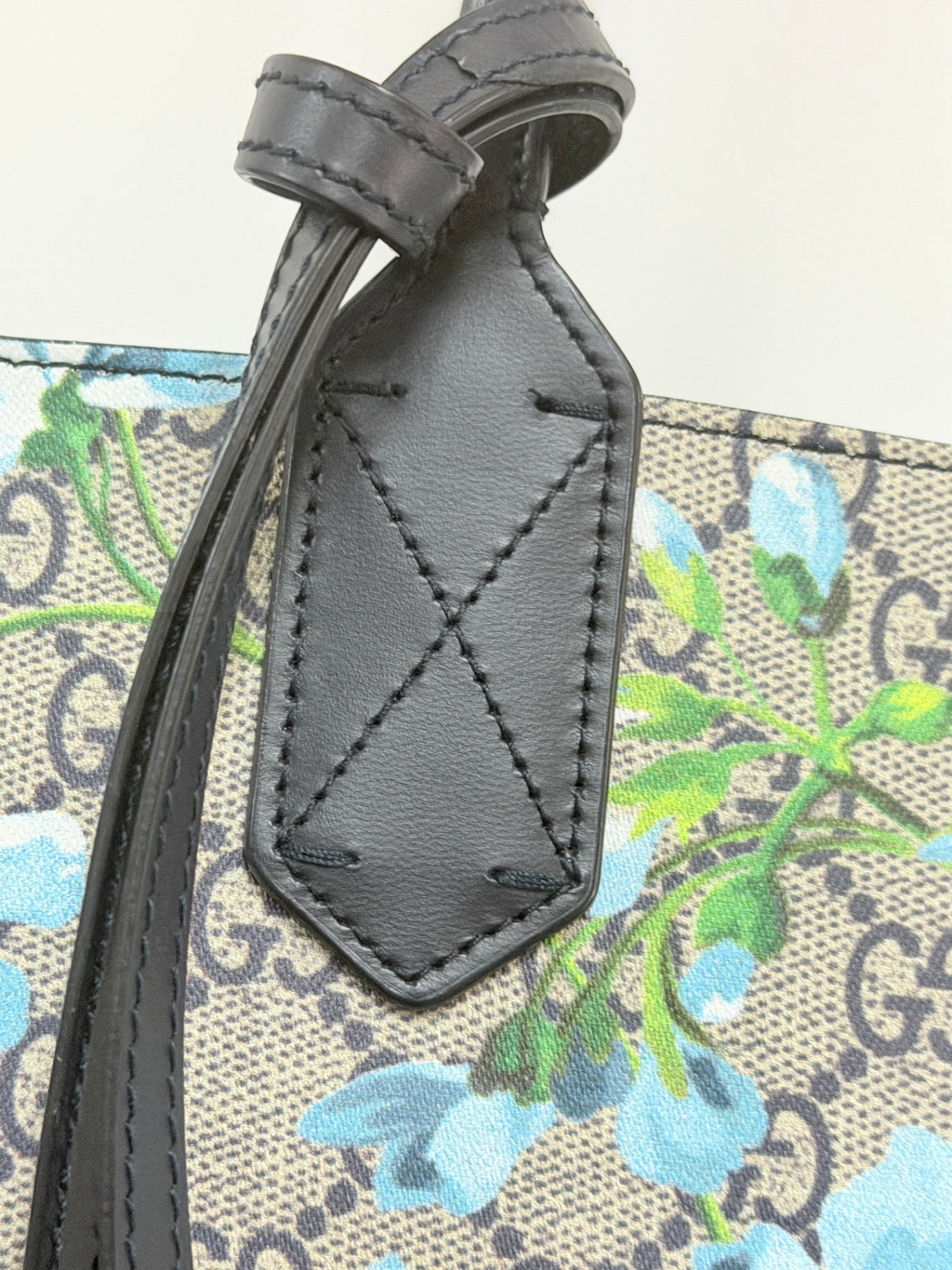 Lynn's Closet Boutique Gucci GG Supreme Blooms tote featuring blue floral print on monogram canvas and black leather trim