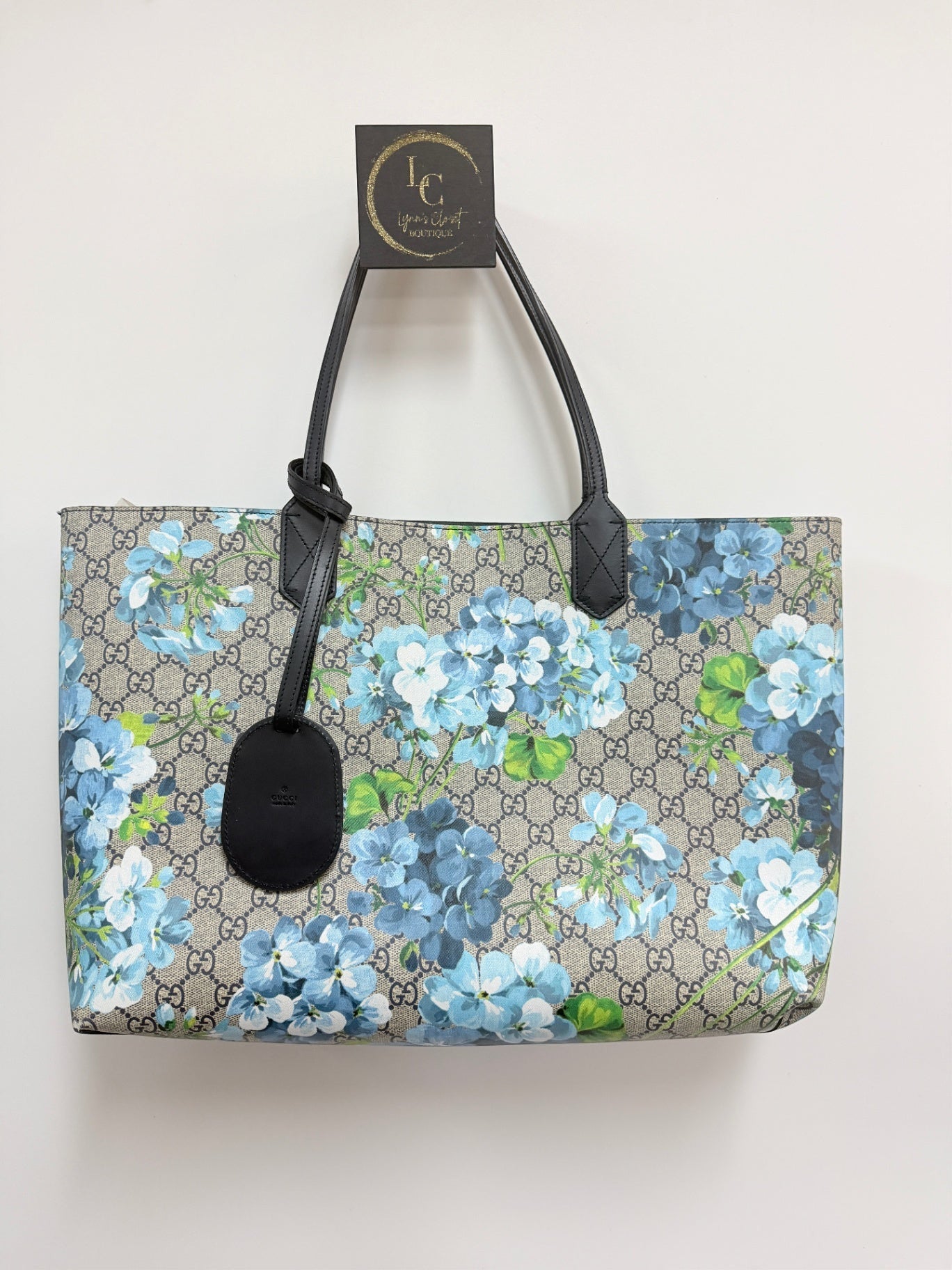 Lynn's Closet Boutique Gucci GG Supreme Blooms reversible tote in beige monogram canvas with blue floral print.