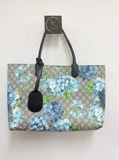 Lynn's Closet Boutique Gucci GG Supreme Blooms reversible tote in beige monogram canvas with blue floral print.