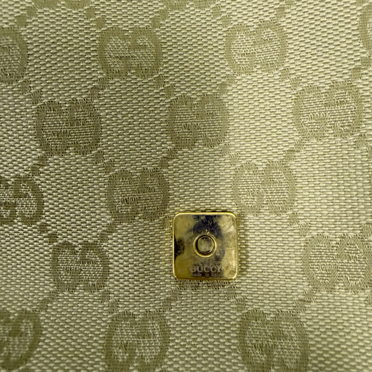 Lynn's Closet Boutique vintage Gucci GG monogram beige canvas bag detail with gold-tone hardware snap closure