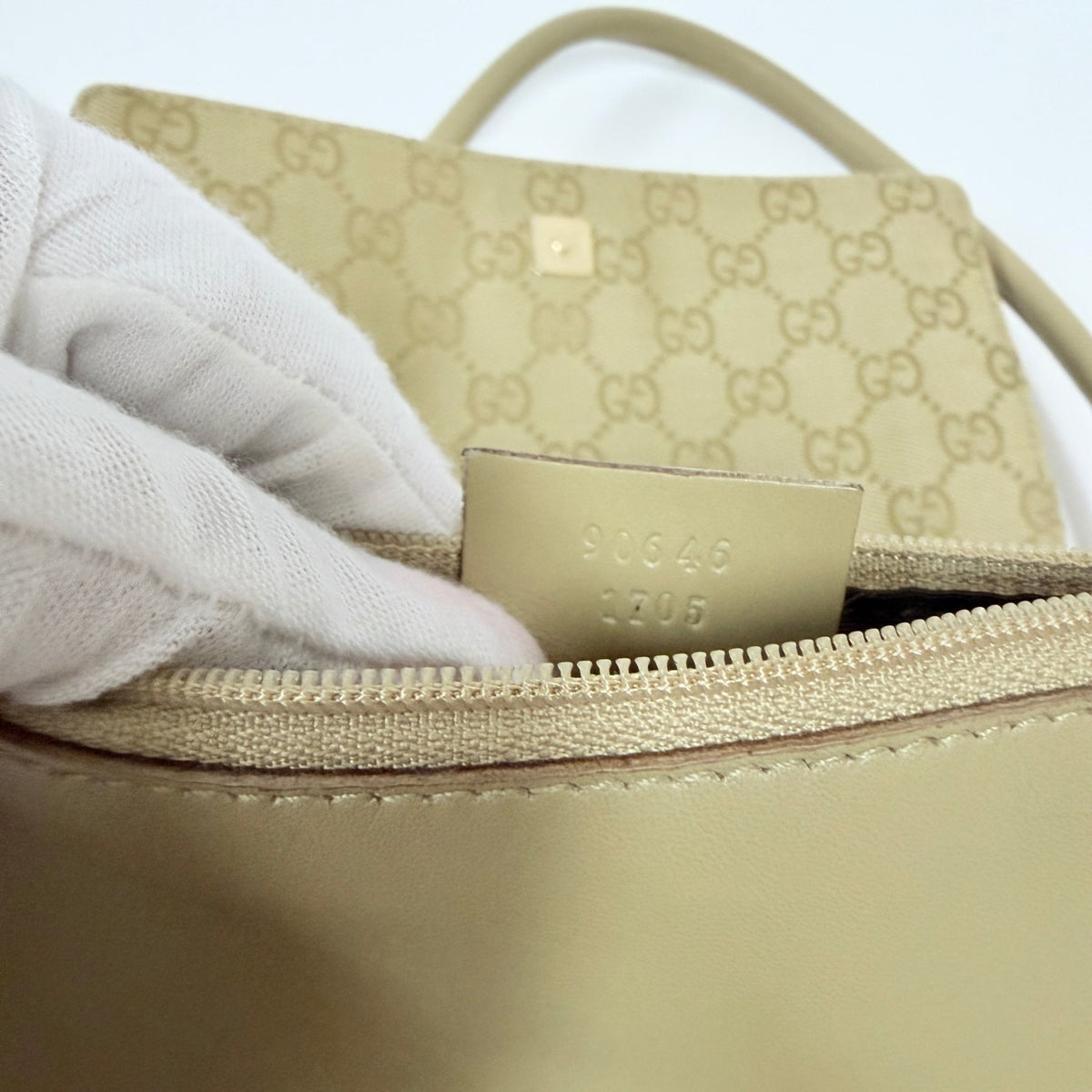 Lynn's Closet Boutique vintage Gucci GG canvas bag interior showing leather serial number tag and beige monogram