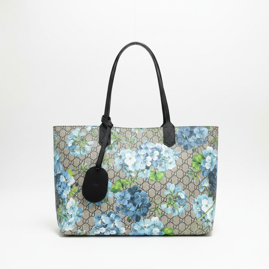 Lynn's Closet Boutique Gucci GG Supreme reversible tote featuring a blue floral print on beige monogram canvas