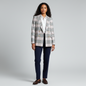 Model wearing a Lynn's Closet Boutique Halogen double-breasted plaid blazer with white shirt and navy trousers