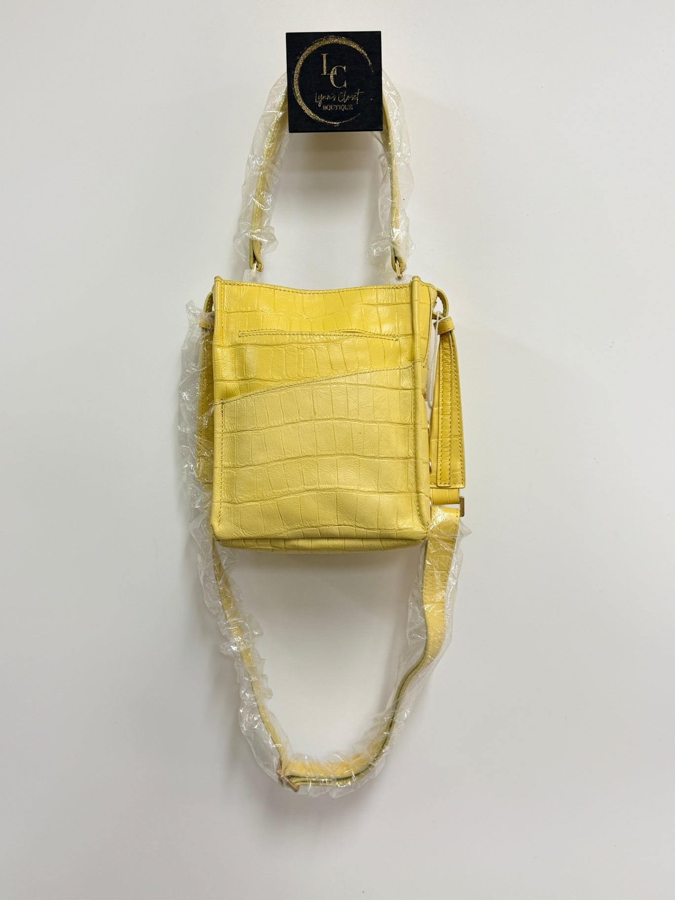 Lynn's Closet Boutique Hammitt yellow crocodile-embossed leather crossbody bag with adjustable strap and slip pocket.