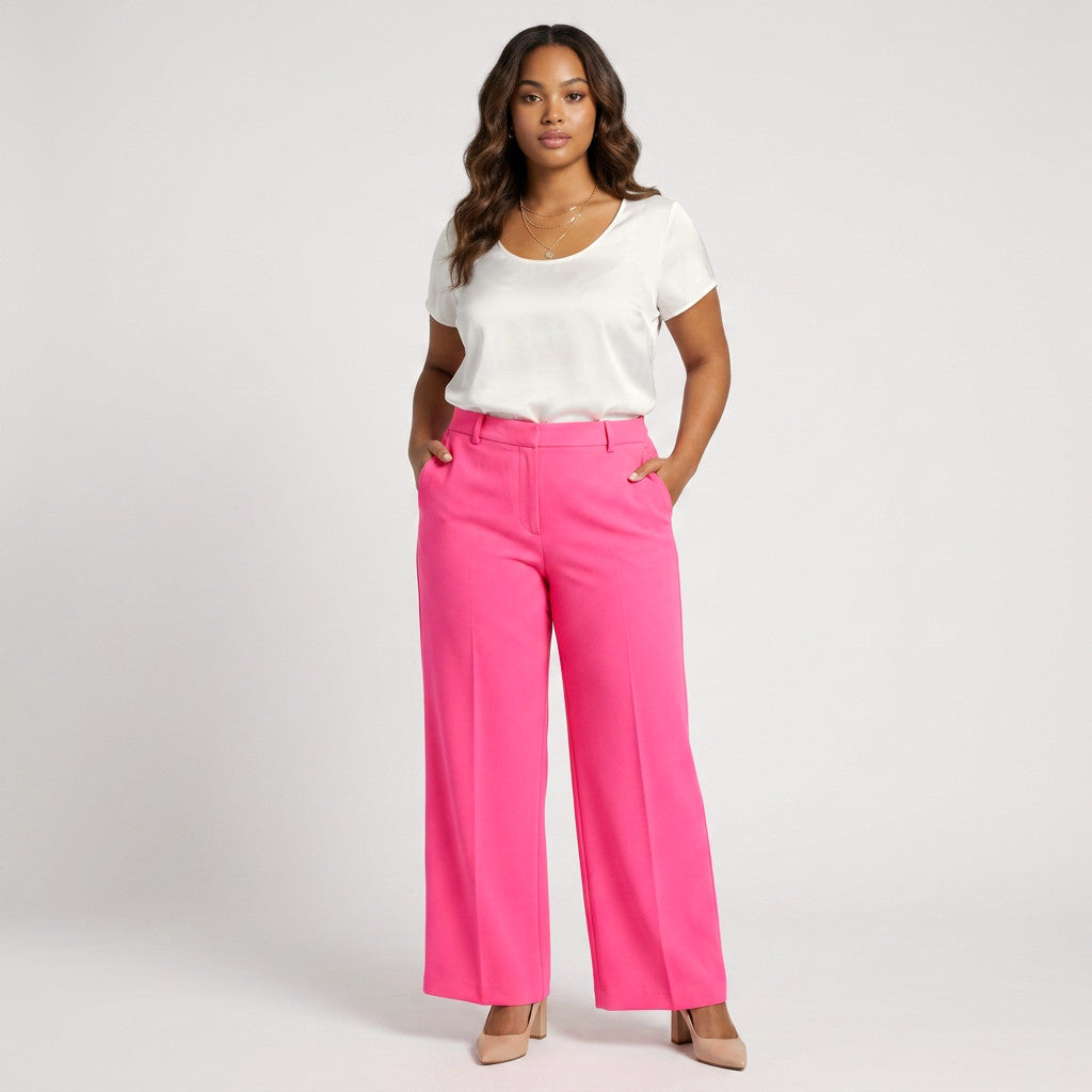 Model wearing Lynn's Closet Boutique L'AGENCE hot pink high-rise wide-leg trousers with a white top and nude heels