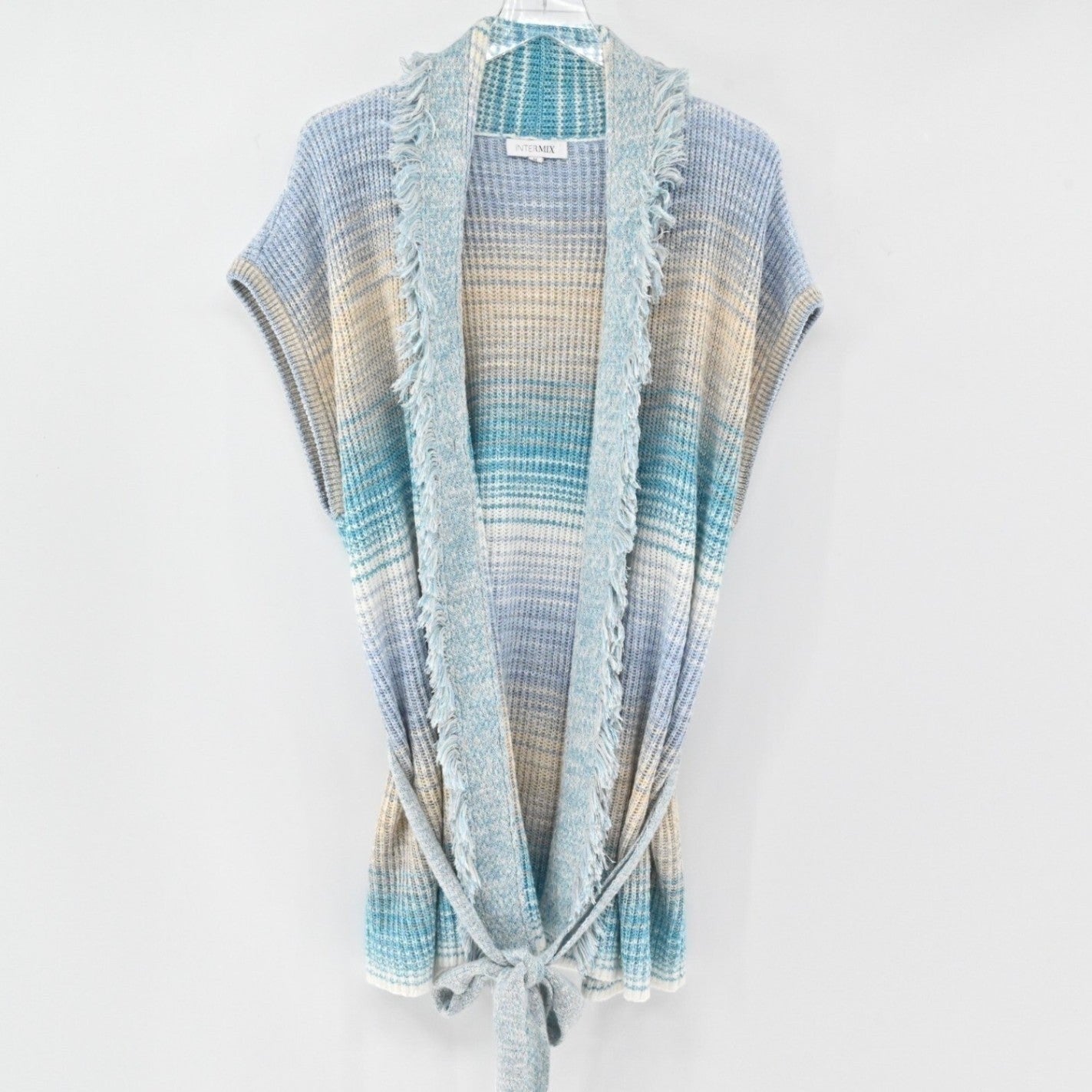 Lynn's Closet Boutique Intermix sleeveless knit cardigan in blue, cream, and sand gradient with fringe collar and belt
