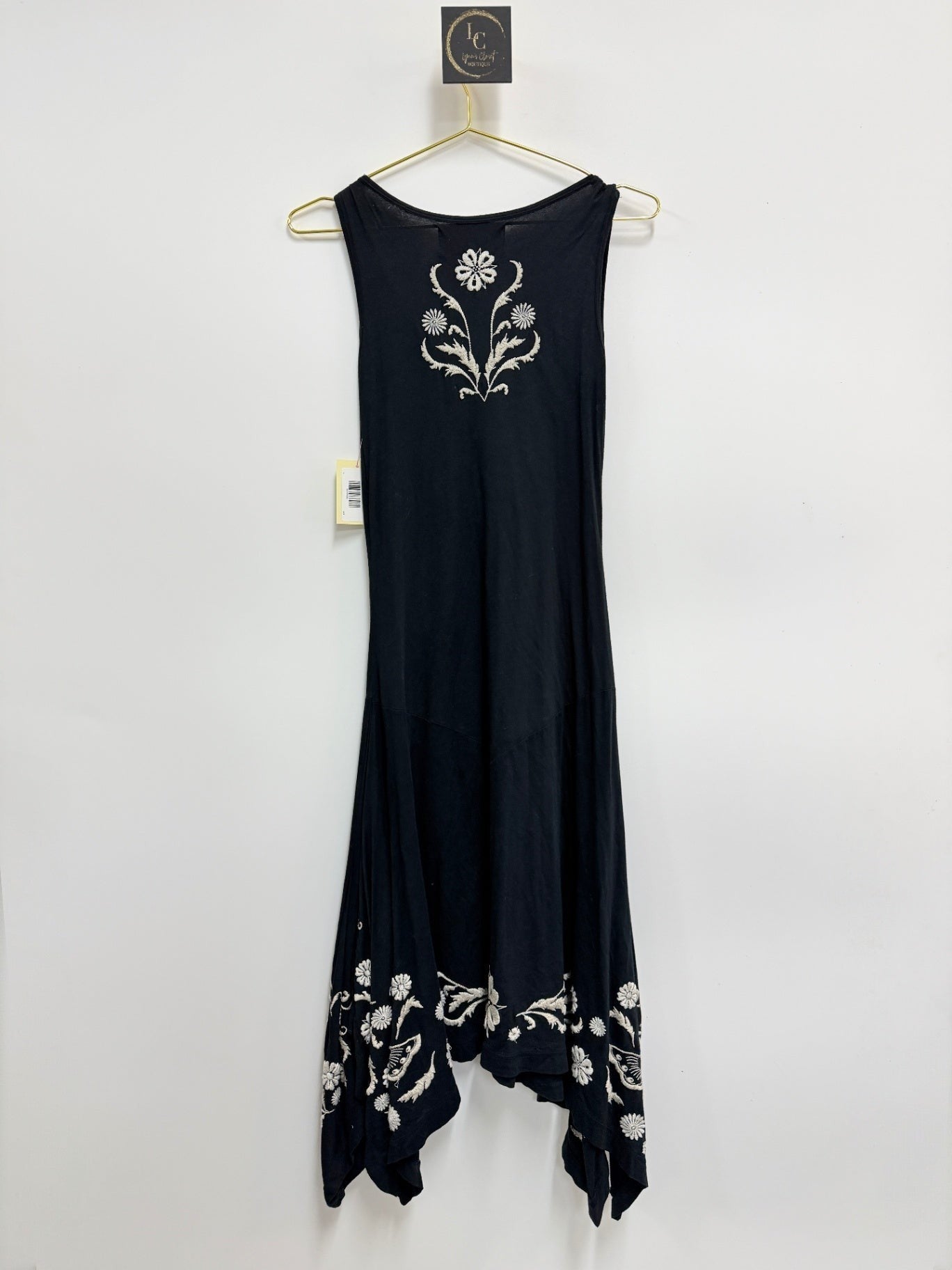 Lynn's Closet Boutique black sleeveless midi dress by Johnny Was LA featuring white floral embroidery and handkerchief hem