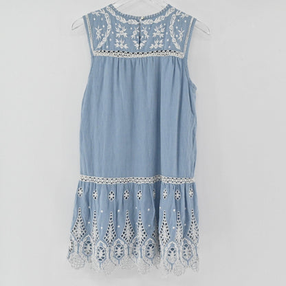 Lynn's Closet Boutique dusty blue Joie mini dress with white floral embroidery, ladder-stitch trim, and eyelet lace hem.