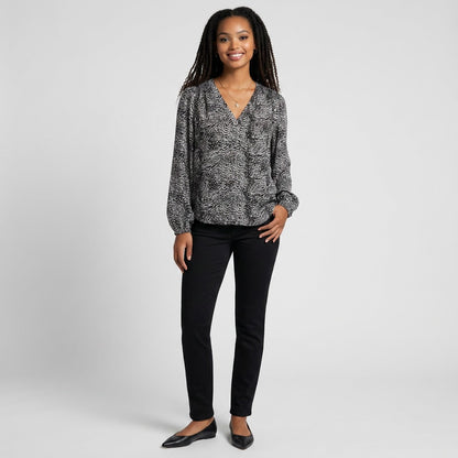 Lynn's Closet Boutique Joie silk animal print blouse with long sleeves and V-neck worn by a smiling model.