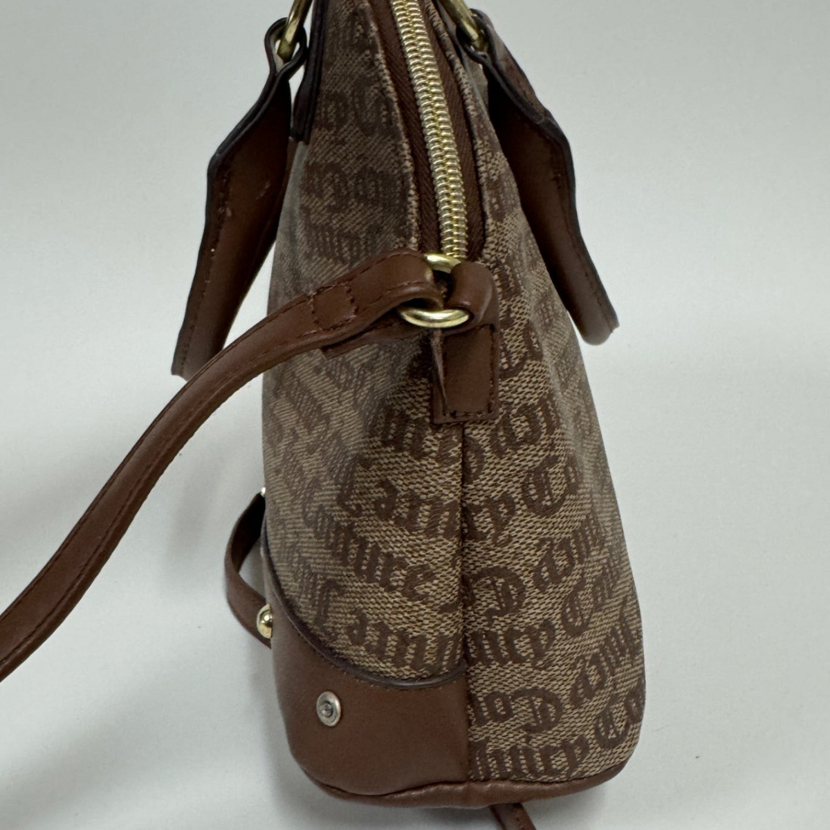 Lynn's Closet Boutique Juicy Couture chestnut and chino dome satchel with gold hardware and side view profile