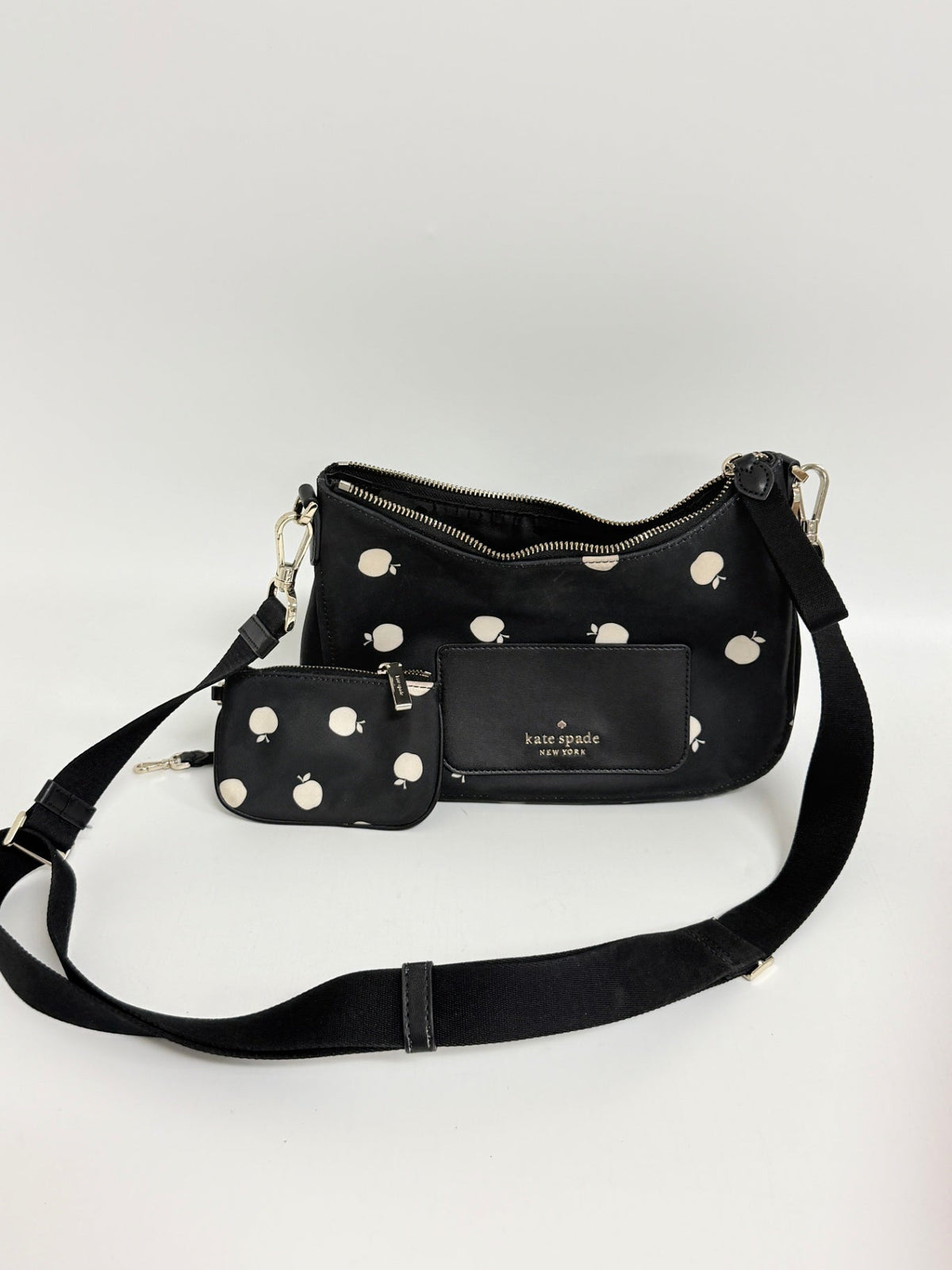 Lynn's Closet Boutique Kate Spade Chelsea nylon crossbody bag in black with white apple print and detachable pouch.