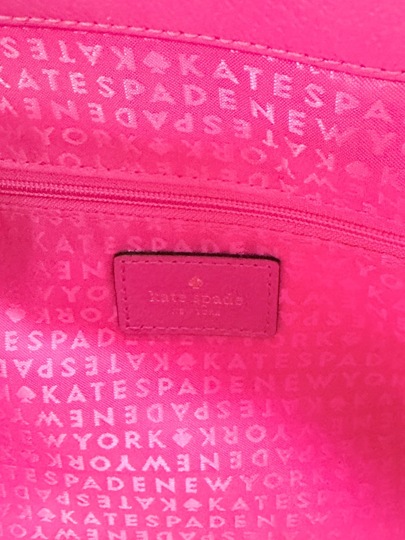 Lynn's Closet Boutique hot pink Kate Spade New York tote bag interior lining with logo patch and zipper pocket