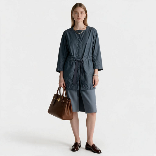 Model wearing Lynn's Closet Boutique Lafayette 148 NY blue-gray metallic drawstring jacket with matching shorts