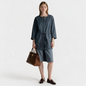 Model wearing Lynn's Closet Boutique Lafayette 148 NY blue-gray metallic drawstring jacket with matching shorts