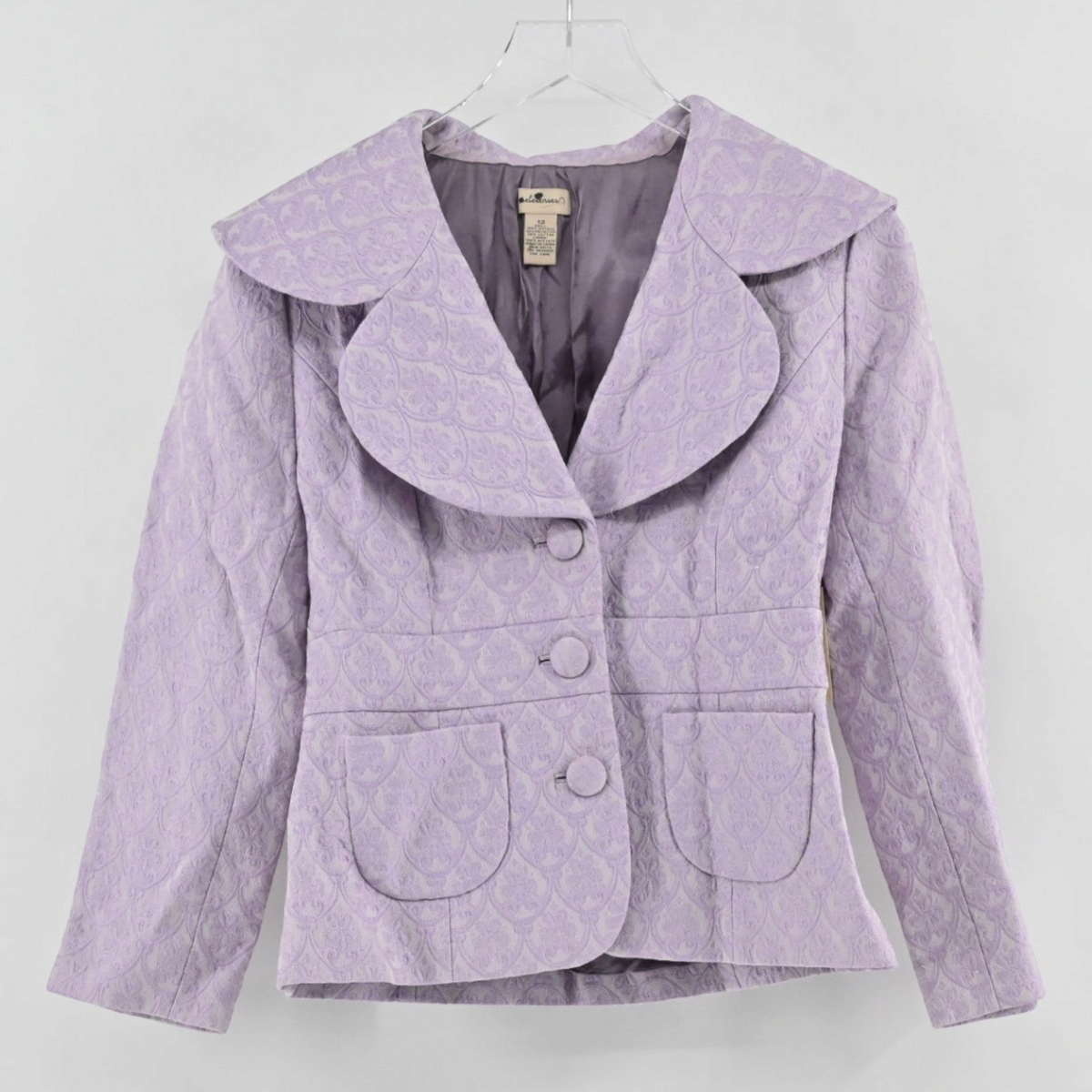 Lynn's Closet Boutique Anthropologie lavender purple brocade blazer with an oversized collar and three-button closure.
