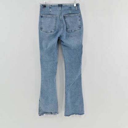 Lynn's Closet Boutique light wash high-rise flare jeans with back pockets and frayed split hem detail