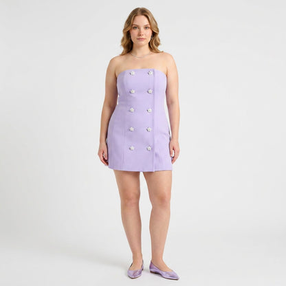 Model wearing a Lynn's Closet Boutique lilac strapless bustier dress with double-breasted floral button details