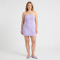 Model wearing a Lynn's Closet Boutique lilac strapless bustier dress with double-breasted floral button details