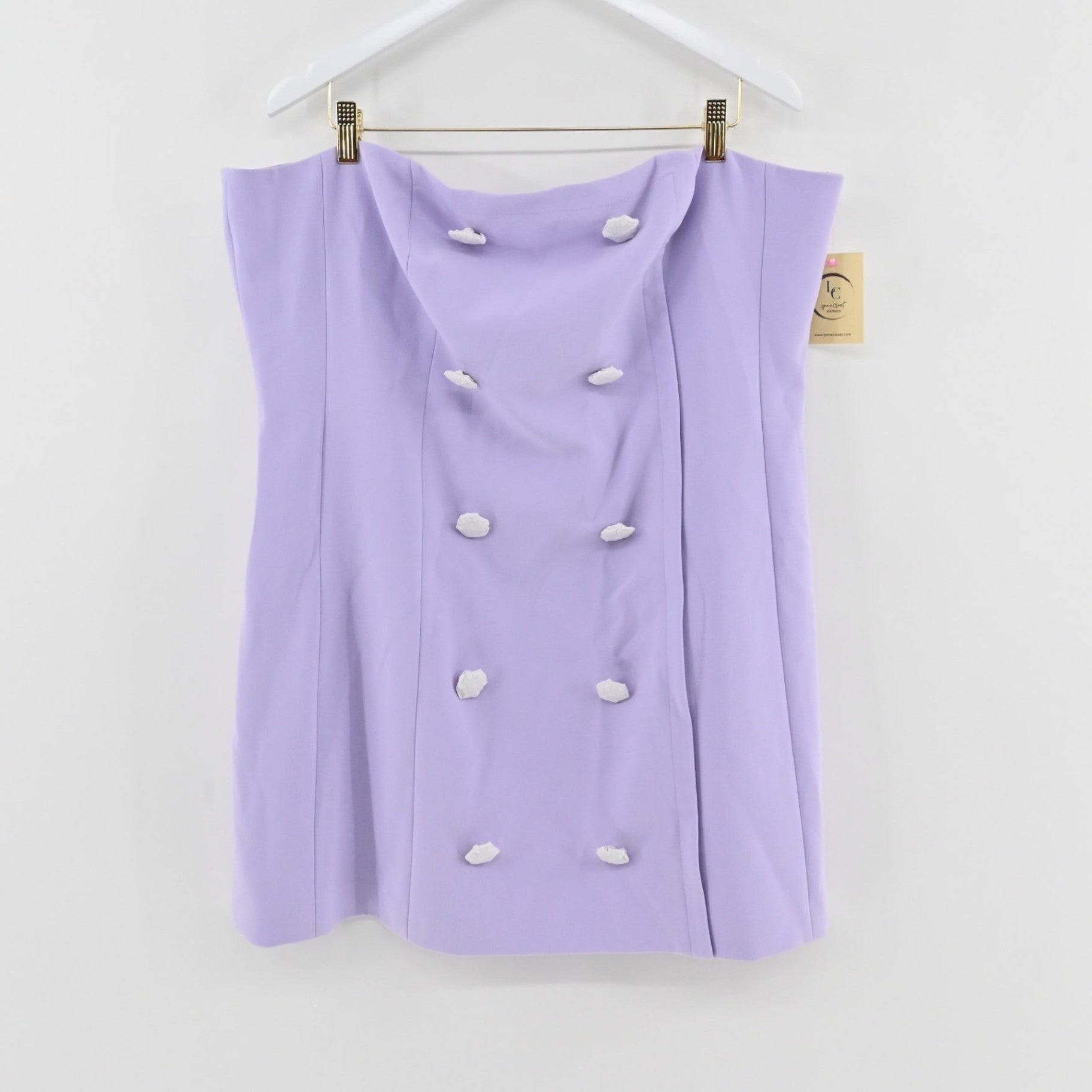 Lynn's Closet Boutique lilac strapless bustier dress with double-breasted button detail hanging on a white hanger