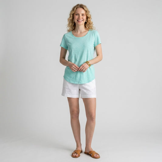 Lynn's Closet Boutique Lilly Pulitzer Etta aqua scoop neck t-shirt worn by a blonde model with white shorts