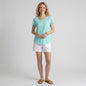 Lynn's Closet Boutique Lilly Pulitzer Etta aqua scoop neck t-shirt worn by a blonde model with white shorts