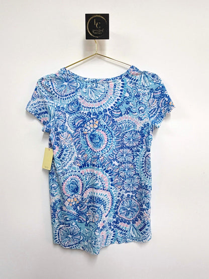 Lynn's Closet Boutique Lilly Pulitzer Etta short-sleeve tee featuring a blue and pink kaleidoscope print on a hanger.