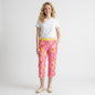 Model wearing Lynn's Closet Boutique Lilly Pulitzer pink and orange monkey print cropped pants with yellow waistband.
