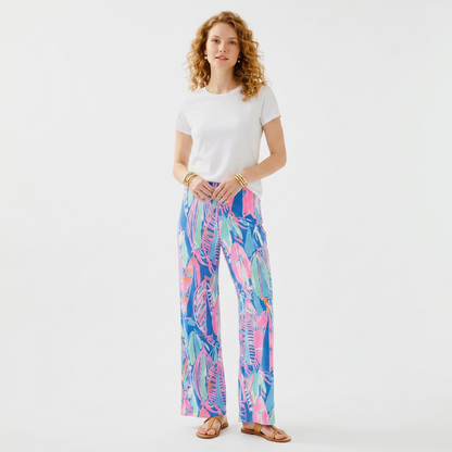 Model wearing Lynn's Closet Boutique Lilly Pulitzer Georgia May palazzo pants in blue and pink Out To Sea print
