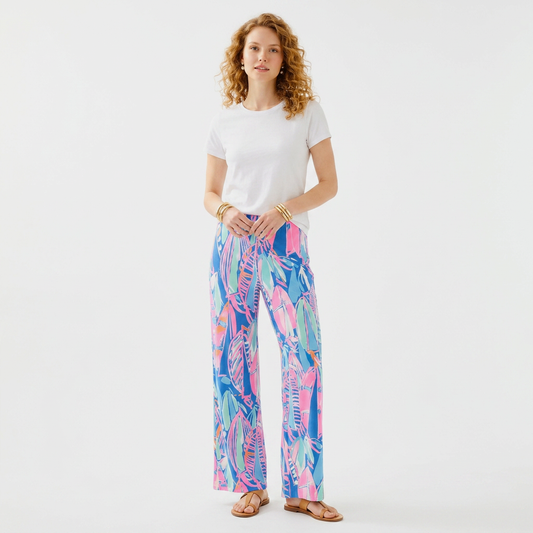 Model wearing Lynn's Closet Boutique Lilly Pulitzer Georgia May palazzo pants in blue and pink Out To Sea print