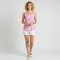 Lynn's Closet Boutique model wearing a Lilly Pulitzer reversible tank top in pink floral turtle print with white shorts