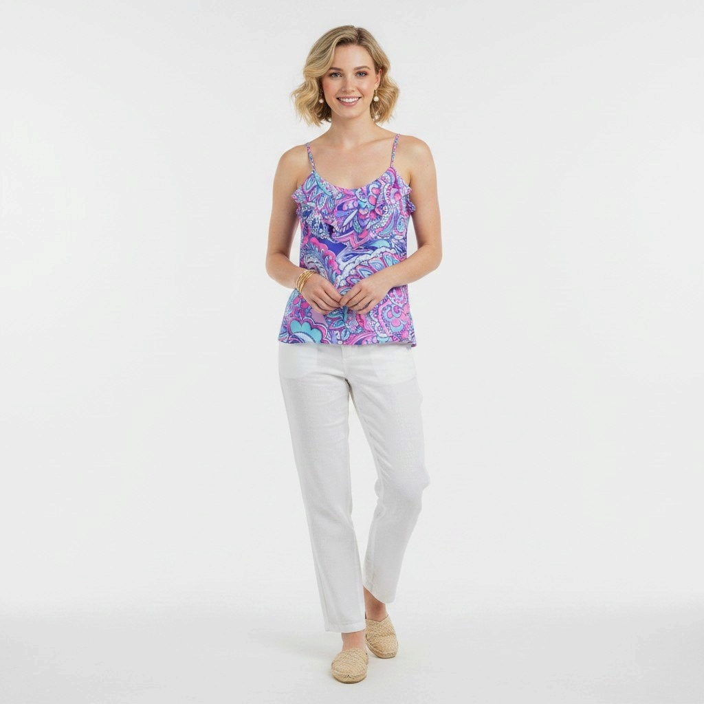 Model wearing a Lynn's Closet Boutique Lilly Pulitzer Karmen Cami with a pink tropical print and ruffle neckline.