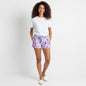 Model wearing Lynn's Closet Boutique Lilly Pulitzer Callahan shorts in Let's Cha Cha floral print with a white tee.