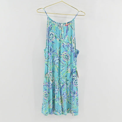 Lynn's Closet Boutique Lilly Pulitzer Gianni skort romper in blue turtle print with a halter neckline on a hanger