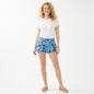 Model wearing Lynn's Closet Boutique Lilly Pulitzer Callahan shorts in a blue and teal tropical print with a white tee