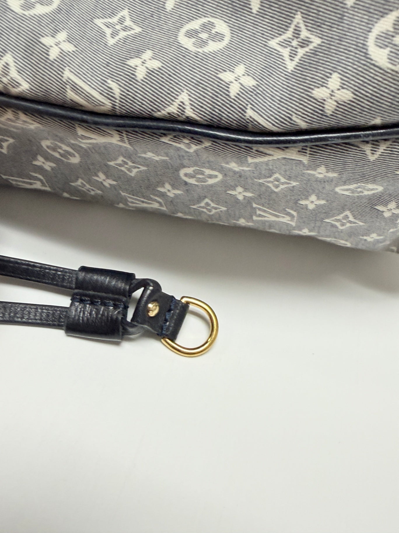 Lynn's Closet Boutique Louis Vuitton Neverfull MM navy Monogram Idylle canvas side detail with leather trim and gold ring