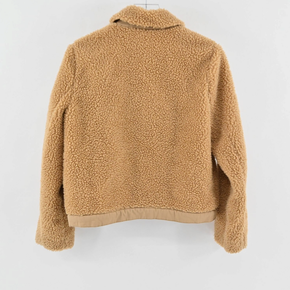 Back view of a Madewell camel sherpa fleece jacket with a structured collar and textured plush fabric.