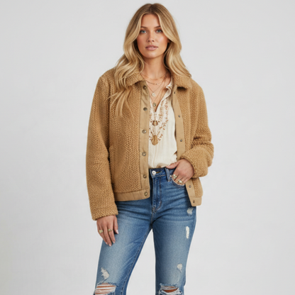Model wearing a camel-colored Madewell sherpa fleece jacket with a button-down front and structured collar.