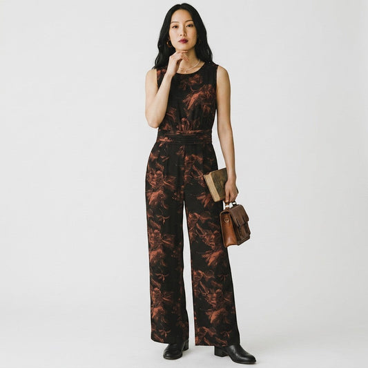 Lynn's Closet Boutique Madewell x No. 6 sleeveless wide-leg jumpsuit in black and rust floral print on a model.