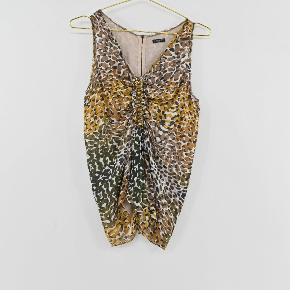 Lynn's Closet Boutique Magaschoni sleeveless top with olive, mustard, and brown animal print and center-front ruching.