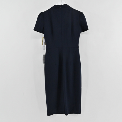 Lynn's Closet Boutique Maggy London navy midi sheath dress with short sleeves and back view on a hanger.
