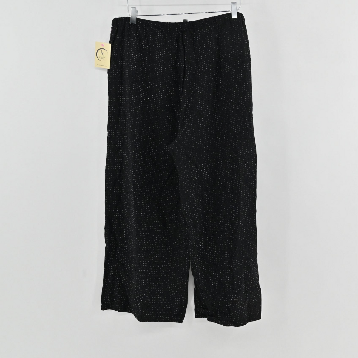 Lynn's Closet Boutique Eileen Fisher metallic black wide-leg pants with subtle white dot pattern and elastic waist.