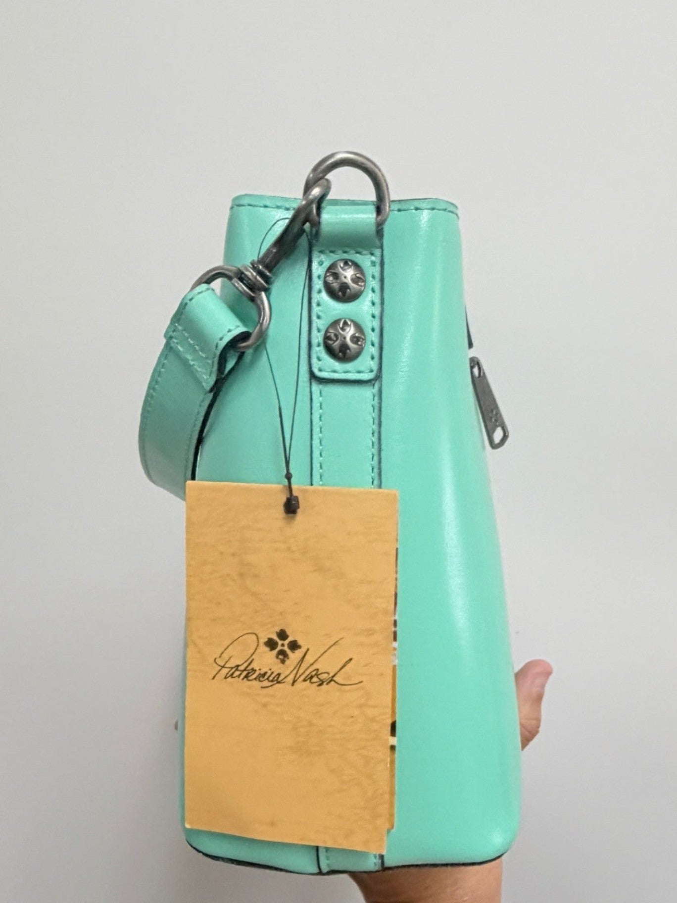 Lynn's Closet Boutique Patricia Nash Irving mint leather bucket bag with side view and brand tag