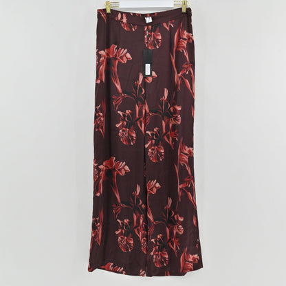 Lynn's Closet Boutique Misook burgundy satin crepe straight-leg pants with a bold red floral print and tags attached.