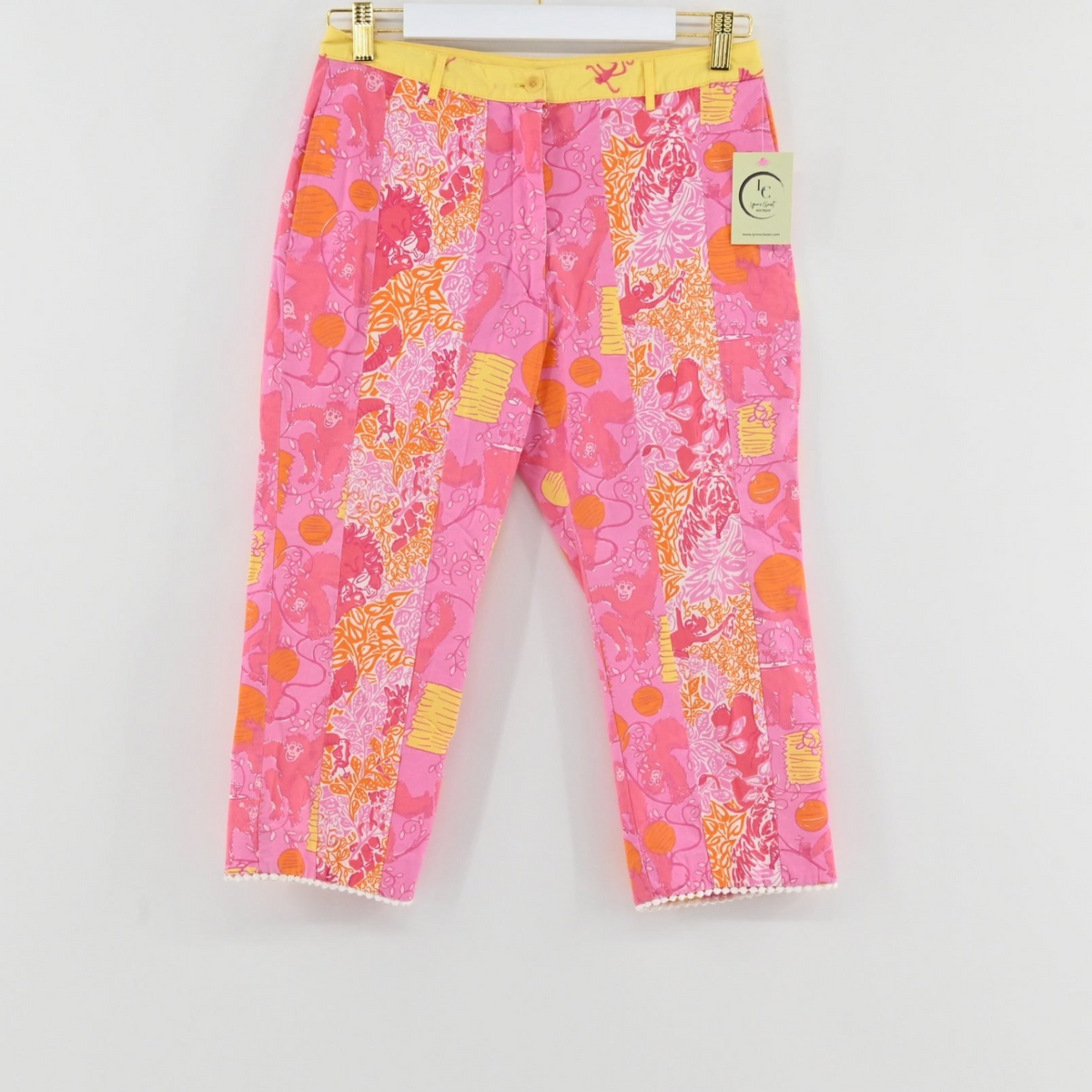 Lynn's Closet Boutique Lilly Pulitzer pink and orange monkey print cropped pants with yellow waistband and pom-pom hem
