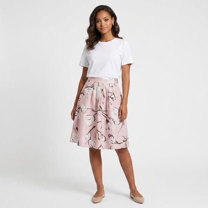 Lynn's Closet Boutique Moschino Cheap Chic pink silk floral midi skirt worn by a model with a white t-shirt